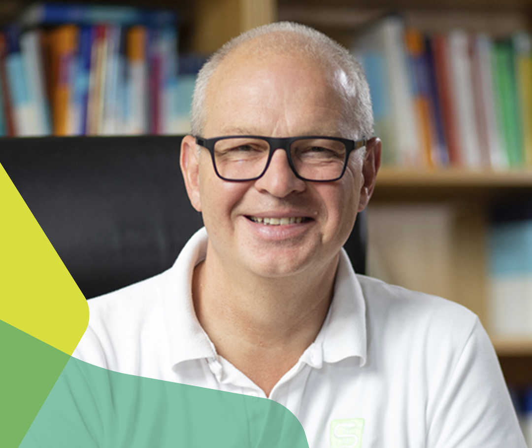 Dr. med. Markus Heibel lächelt in die Kamera